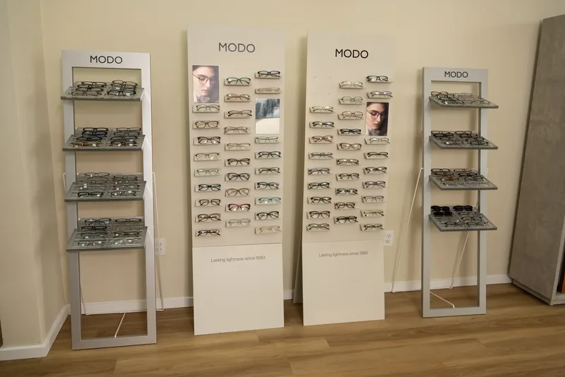 Four MODO floor stands holding rows of lightweight frames