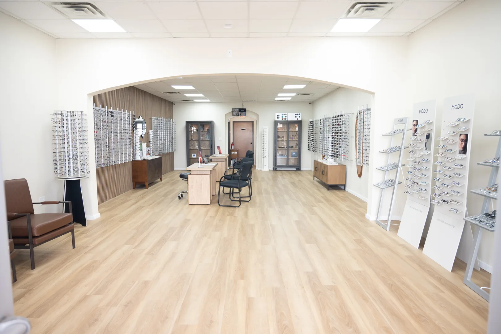 The Kingsley Optical showroom interior, frame displays lining both walls